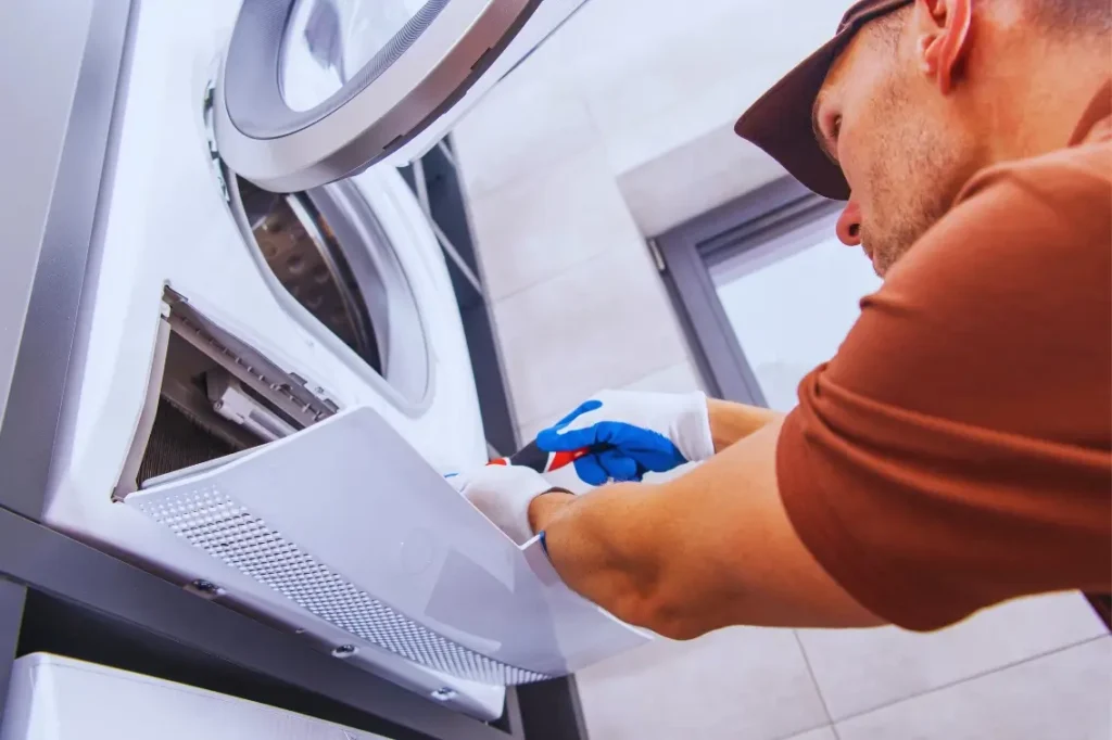 man fixing washer