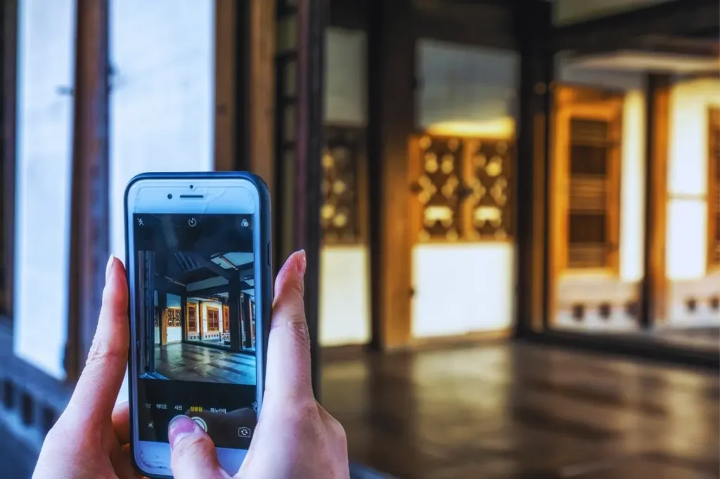 person taking photo with smartphone